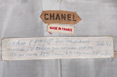 Lot 17 - A Chanel couture grey-pink tweed suit, 1960
