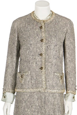 Lot 17 - A Chanel couture grey-pink tweed suit, 1960