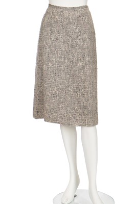 Lot 17 - A Chanel couture grey-pink tweed suit, 1960