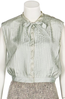 Lot 17 - A Chanel couture grey-pink tweed suit, 1960