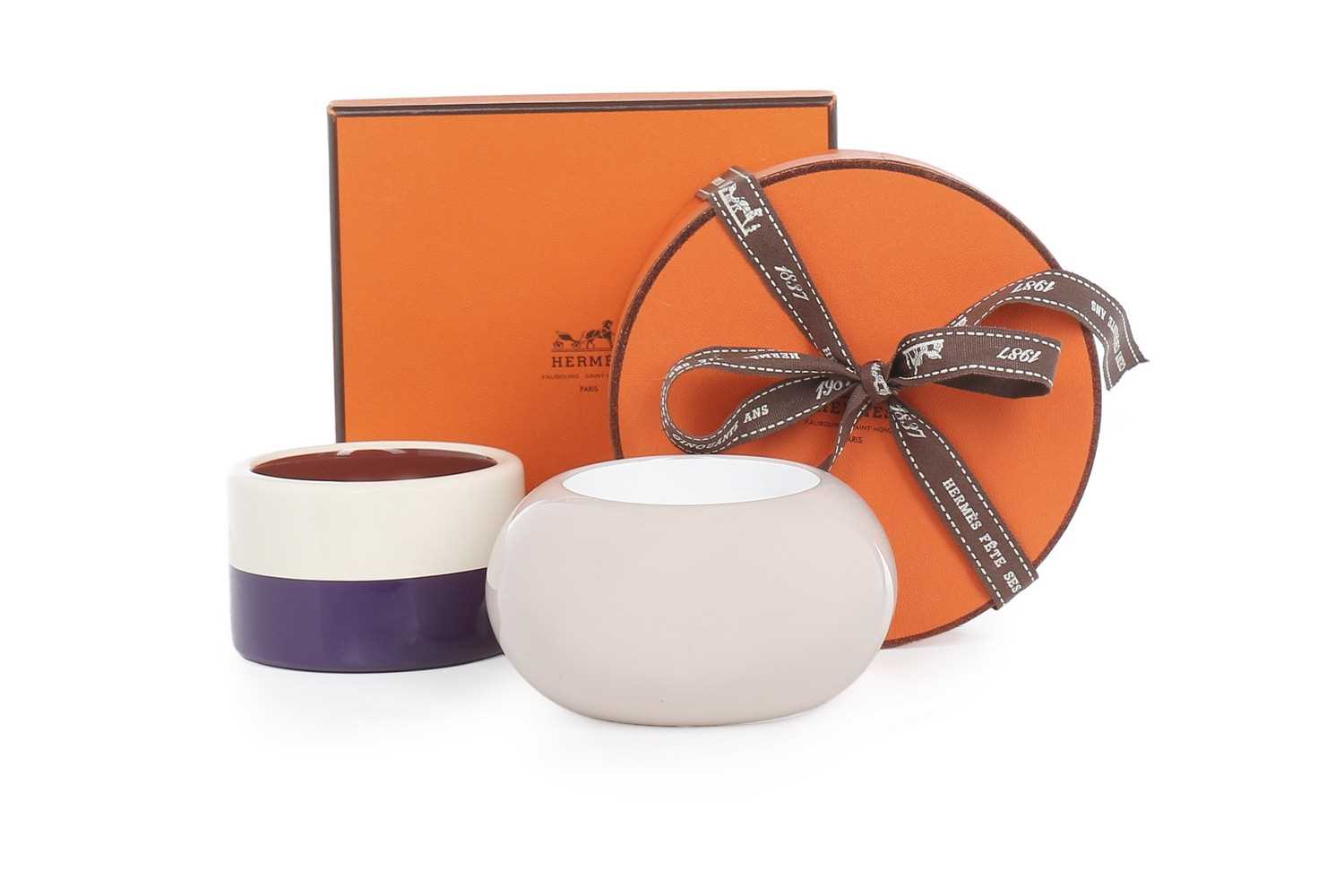 Lot 10 - Two Hermès lacquered 'Assam Bois' bangles,...