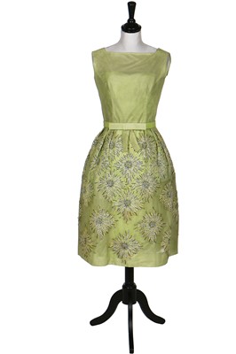 Lot 108 - A Norman Hartnell couture pale green sequinned tulle cocktail dress, circa 1960