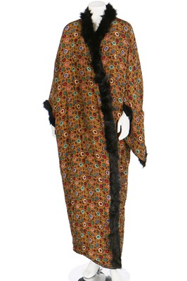 Lot 32 - A kimono-style coat of Poiret-inspired printed silk, edged in black fur, circa 1918