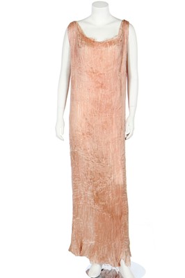 Lot 56 - A Mariano Fortuny pale peach silk Delphos, 1920-30