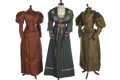 Lot 15 - Three silk gowns in shades of green and brown, 1890s-1910s