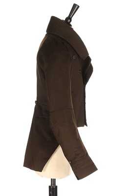 Lot 84 - A rare young man's brown wool tailcoat, 1820s,...