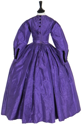 Lot 4 - A gown of violet Mauveine taffeta, 1850s