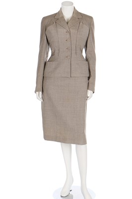Lot 84 - A Schiaparelli flecked beige wool suit, circa 1950