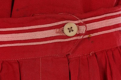 Lot 97 - A red wool-cotton bathing costume, circa 1910,...