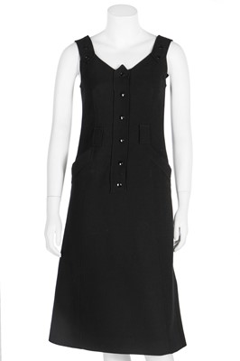 Lot 171 - A Courrèges black wool pinafore dress, French, circa 1970