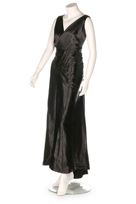 Lot 124 - A Maison Worth couture black satin evening...