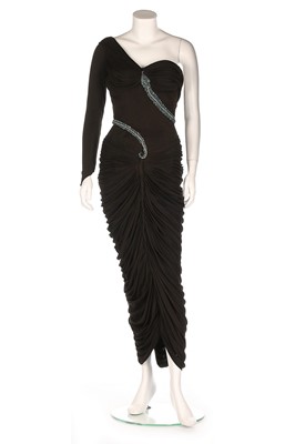 Lot 139 - A draped black jersey 'snake' dress, late...