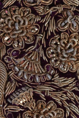 Lot 256 - A men's purple velvet angarkha jacket, Indian, circa 1900