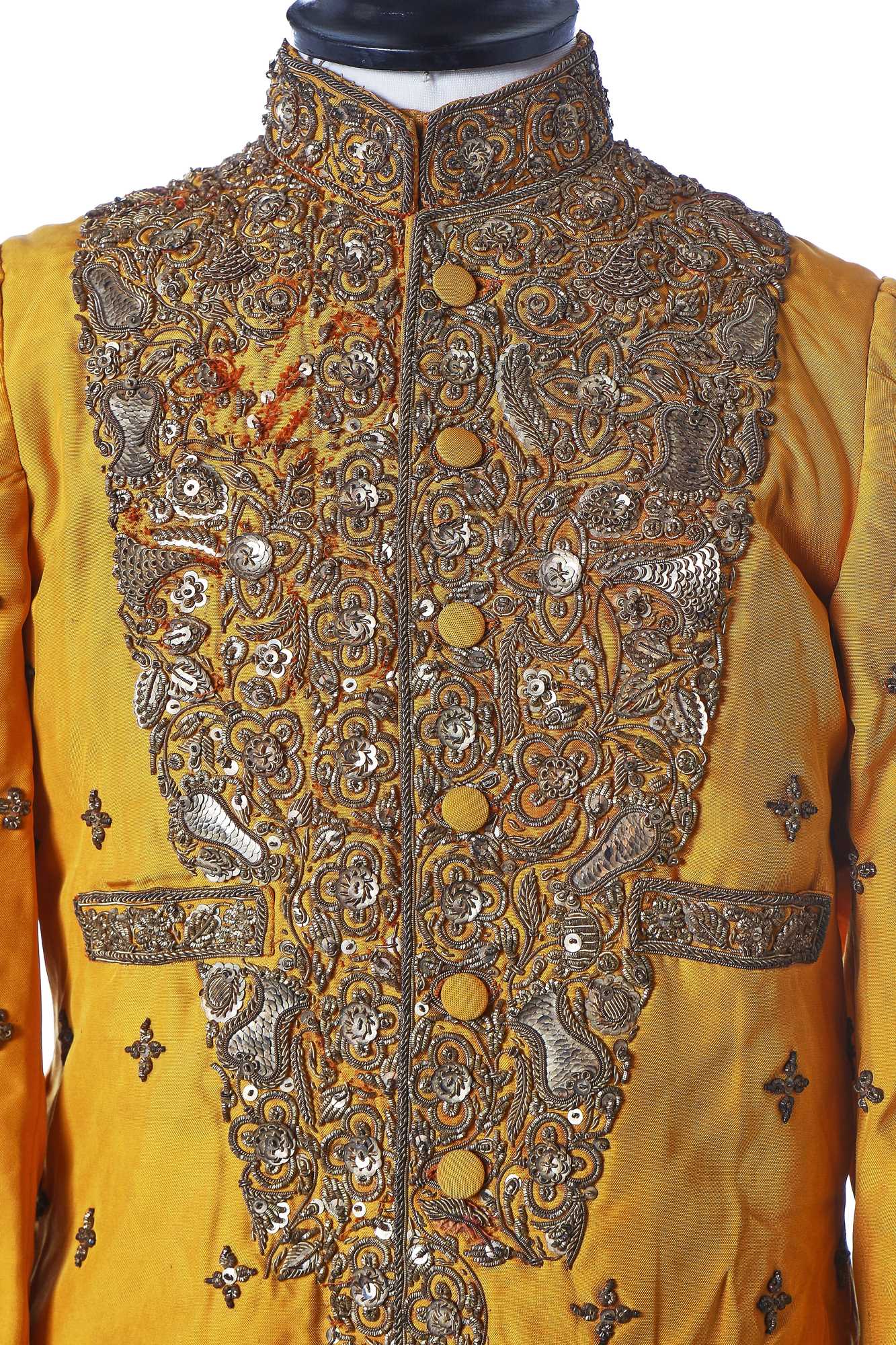 Lot 258 - A young men's brilliant yellow silk court coat, Indian, 1910-20