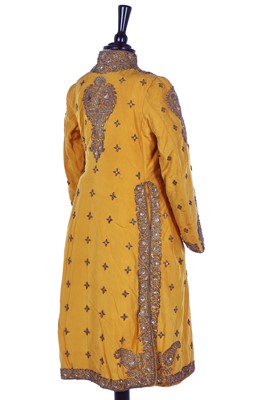 Lot 258 - A young men's brilliant yellow silk court coat, Indian, 1910-20