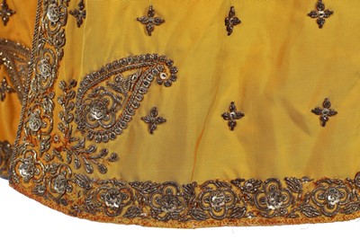 Lot 258 - A young men's brilliant yellow silk court coat, Indian, 1910-20