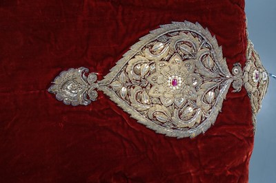 Lot 257 - A boys' embroidered scarlet velvet court coat, Indian, late 19th century
