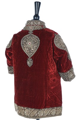 Lot 257 - A boys' embroidered scarlet velvet court coat, Indian, late 19th century