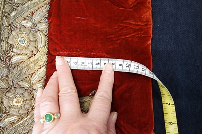 Lot 257 - A boys' embroidered scarlet velvet court coat, Indian, late 19th century