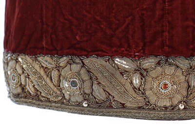 Lot 257 - A boys' embroidered scarlet velvet court coat, Indian, late 19th century