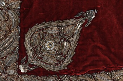 Lot 257 - A boys' embroidered scarlet velvet court coat, Indian, late 19th century