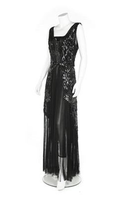 Lot 144 - An elaborately beaded and sequined evening...