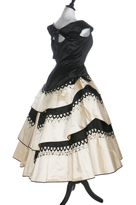 Lot 80 - An Emilio Schuberth couture black satin evening gown, mid 1950s
