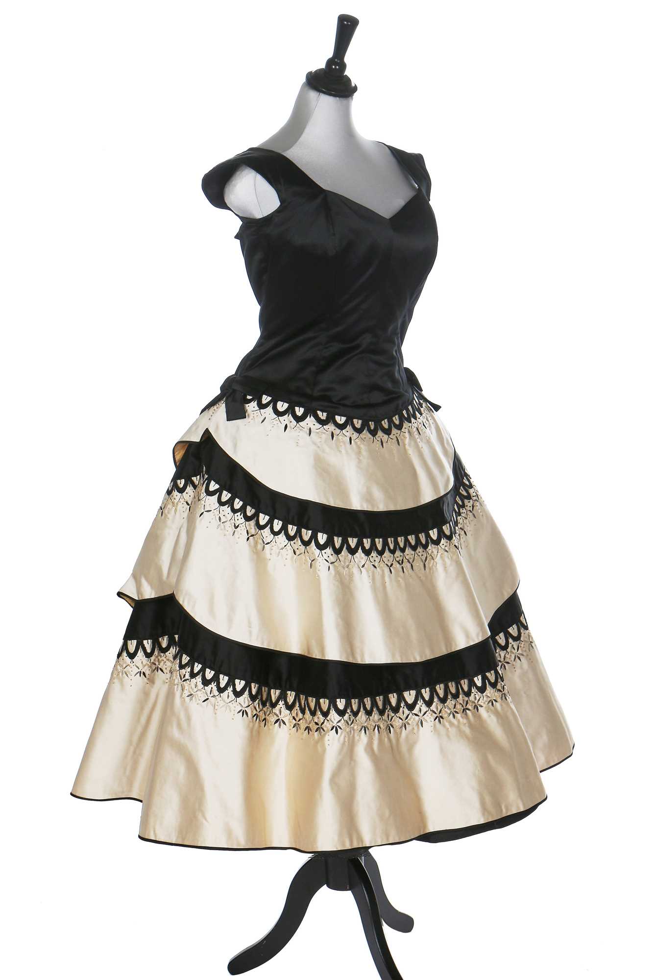 Lot 80 - An Emilio Schuberth couture black satin evening gown, mid 1950s