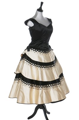 Lot 80 - An Emilio Schuberth couture black satin evening gown, mid 1950s