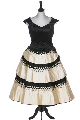 Lot 80 - An Emilio Schuberth couture black satin evening gown, mid 1950s
