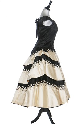Lot 80 - An Emilio Schuberth couture black satin evening gown, mid 1950s
