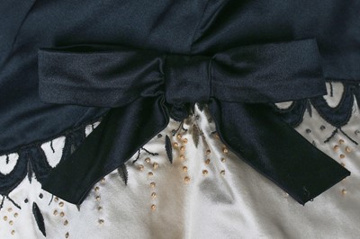 Lot 80 - An Emilio Schuberth couture black satin evening gown, mid 1950s