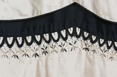 Lot 80 - An Emilio Schuberth couture black satin evening gown, mid 1950s