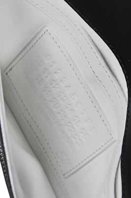 Lot 58 - A group of Maison Margiela for H&M accessories, 2012
