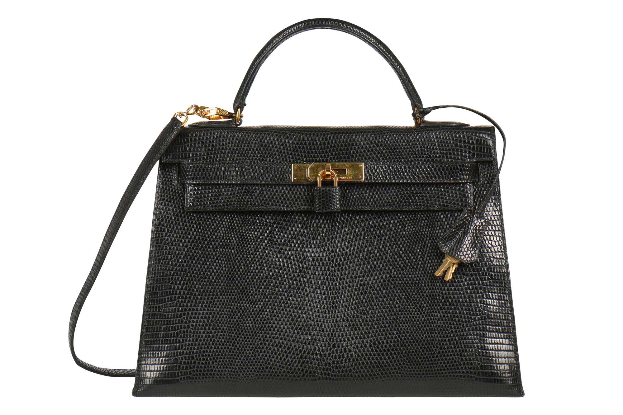 Lot 63 - An Hermès black niloticus lizard Kelly 32, 1989