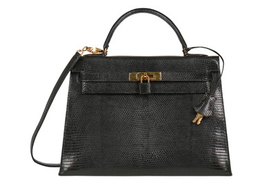 Lot 63 - An Hermès black niloticus lizard Kelly 32, 1989