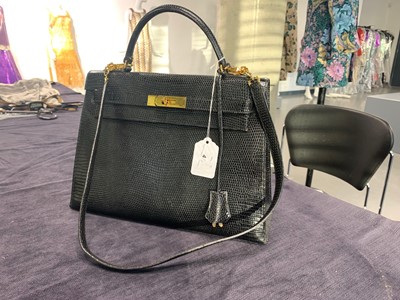 Lot 63 - An Hermès black niloticus lizard Kelly 32, 1989