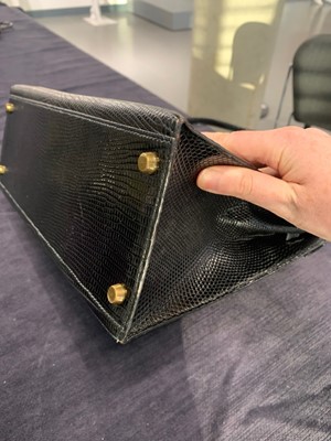 Lot 63 - An Hermès black niloticus lizard Kelly 32, 1989