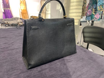 Lot 63 - An Hermès black niloticus lizard Kelly 32, 1989