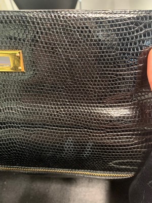 Lot 63 - An Hermès black niloticus lizard Kelly 32, 1989