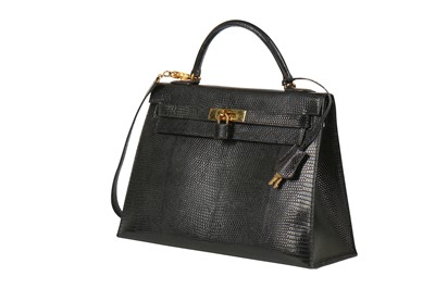 Lot 63 - An Hermès black niloticus lizard Kelly 32, 1989