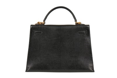 Lot 63 - An Hermès black niloticus lizard Kelly 32, 1989