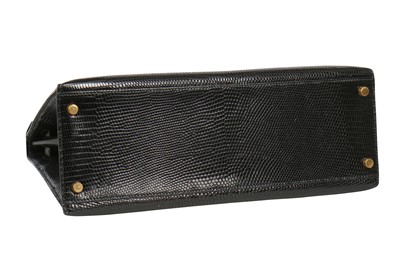 Lot 63 - An Hermès black niloticus lizard Kelly 32, 1989