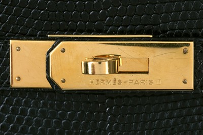 Lot 63 - An Hermès black niloticus lizard Kelly 32, 1989