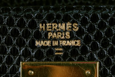Lot 63 - An Hermès black niloticus lizard Kelly 32, 1989