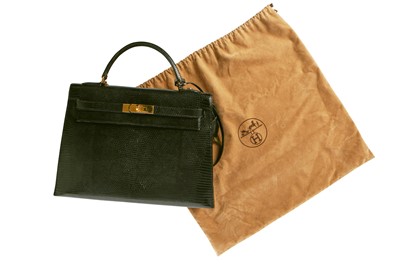 Lot 63 - An Hermès black niloticus lizard Kelly 32, 1989