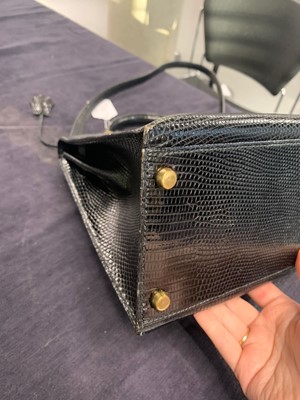 Lot 63 - An Hermès black niloticus lizard Kelly 32, 1989
