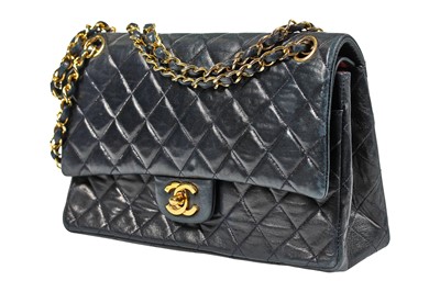 Lot 8 - A Chanel navy quilted lambskin leather flap bag, 1980s