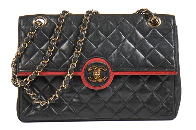 Lot 6 - A Chanel black quilted lambskin leather flap bag, 1980s