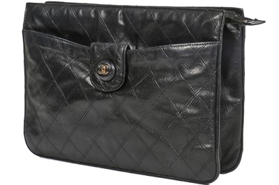 Lot 13 - A Chanel quilted black lambskin leather pochette, 1986-88